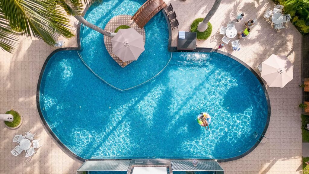 Cinematic luxury resort pool aerial by Contel Production.