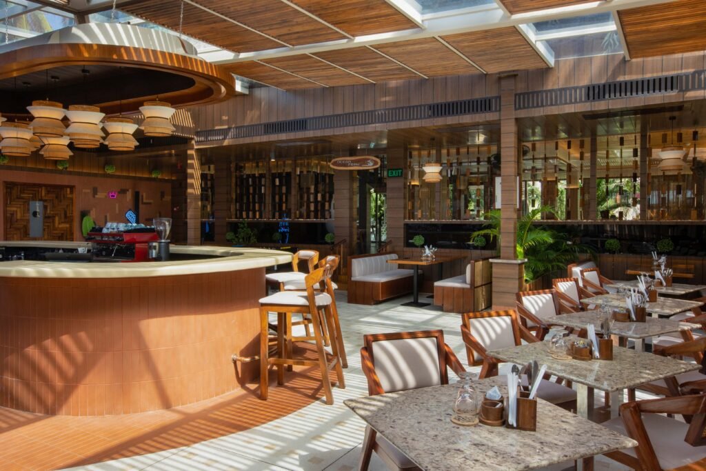 Interior view of a luxury hotel breakfast bar and dining area, an example of professional hotel visuals.